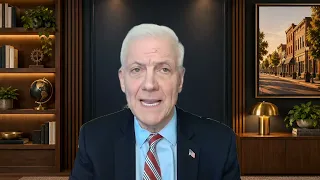 Dan Varroney discussing interest rates and business investment in front of a library background